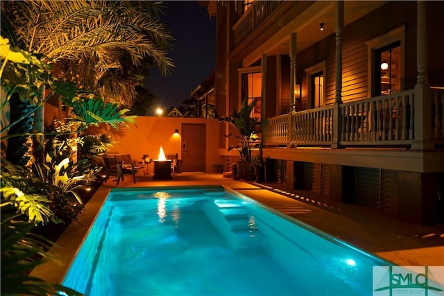102 E 38th St, Savannah, GA 31401 - pool at night featuring a patio area