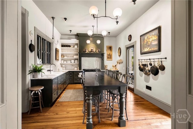 102 E 38th St, Savannah, GA 31401 - dining space featuring light wood-style floors and a chandelier