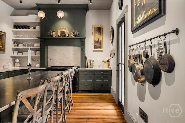 102 E 38th St, Savannah, GA 31401 - bar area with light wood-type flooring and pendant lighting