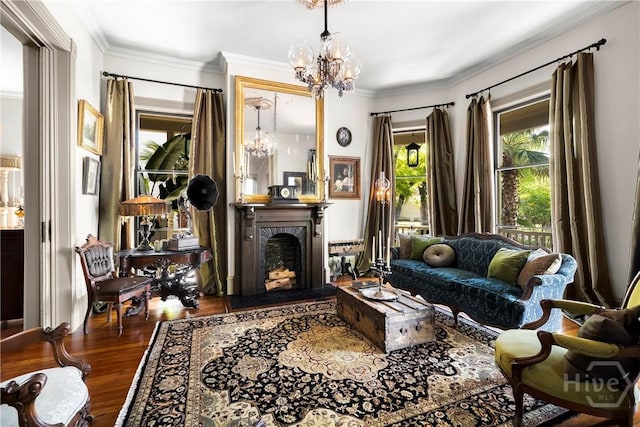 102 E 38th St, Savannah, GA 31401 - living area with a chandelier, crown molding, wood finished floors, and a fireplace with raised hearth