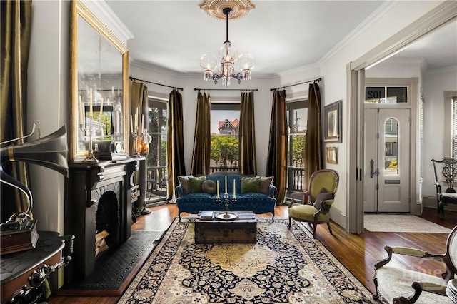 102 E 38th St, Savannah, GA 31401 - living area featuring a chandelier, wood finished floors, ornamental molding, and a tile fireplace
