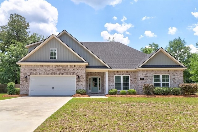 craftsman inspired home featuring brick siding, driveway, roof with shingles, and a garage