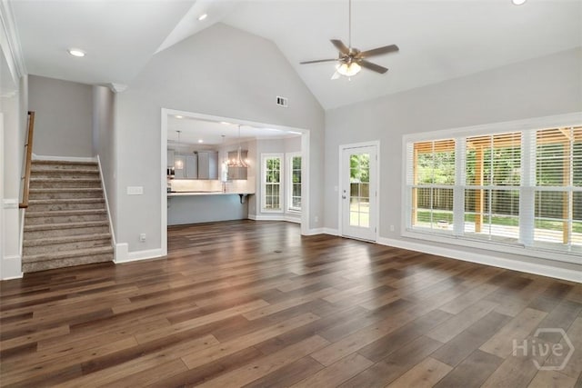 unfurnished living room featuring dark wood-style flooring, a ceiling fan, high vaulted ceiling, stairs, and baseboards