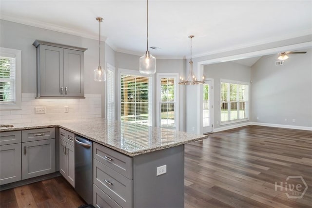 kitchen featuring gray cabinetry, a peninsula, dark wood finished floors, open floor plan, and backsplash