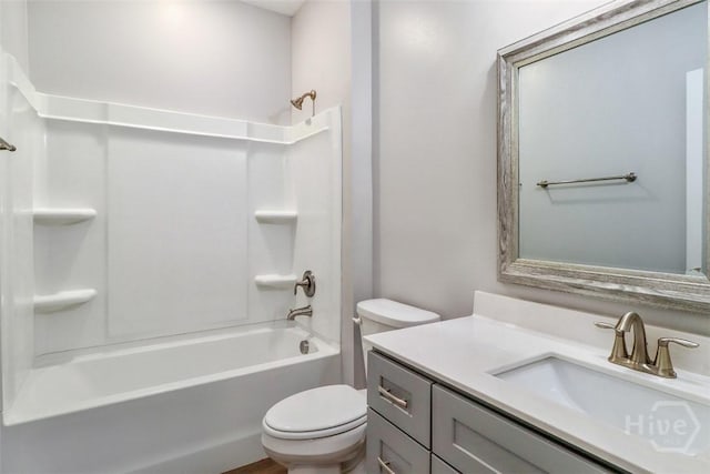 bathroom featuring toilet, tub / shower combination, and vanity