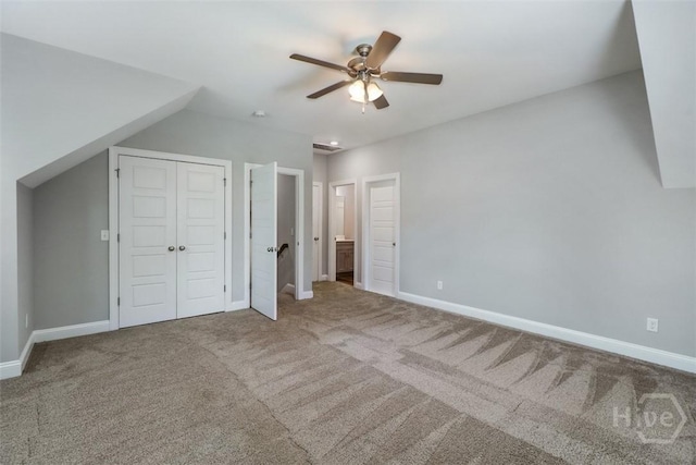 unfurnished bedroom with carpet flooring and baseboards