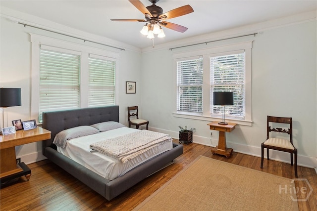 532 E 50th St, Savannah, GA 31405 - bedroom with baseboards, wood finished floors, and a ceiling fan