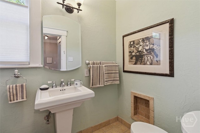 532 E 50th St, Savannah, GA 31405 - bathroom featuring toilet, tile patterned floors, and baseboards