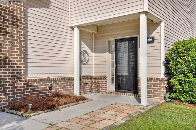 450 Canyon Oak Loop, Richmond Hill, GA 31324 - property entrance with brick siding