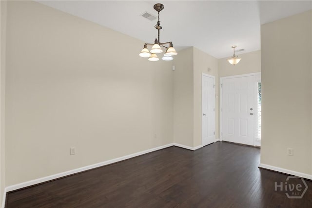 450 Canyon Oak Loop, Richmond Hill, GA 31324 - unfurnished room with dark wood-type flooring, a chandelier, and baseboards