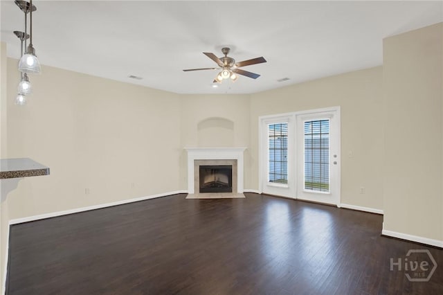 450 Canyon Oak Loop, Richmond Hill, GA 31324 - unfurnished living room with a ceiling fan, dark wood-type flooring, a fireplace, and baseboards