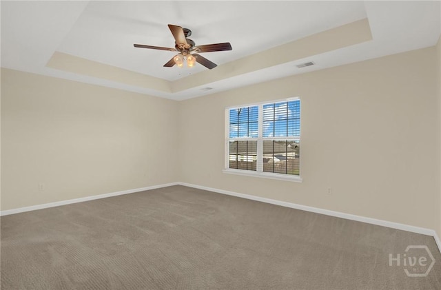 450 Canyon Oak Loop, Richmond Hill, GA 31324 - carpeted empty room featuring a tray ceiling, baseboards, and a ceiling fan