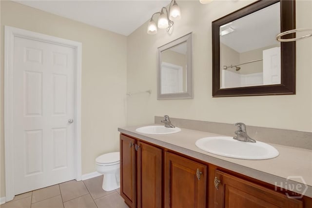450 Canyon Oak Loop, Richmond Hill, GA 31324 - bathroom featuring tile patterned flooring, toilet, double vanity, and baseboards