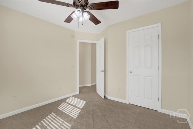 450 Canyon Oak Loop, Richmond Hill, GA 31324 - unfurnished bedroom with carpet flooring, baseboards, and a ceiling fan