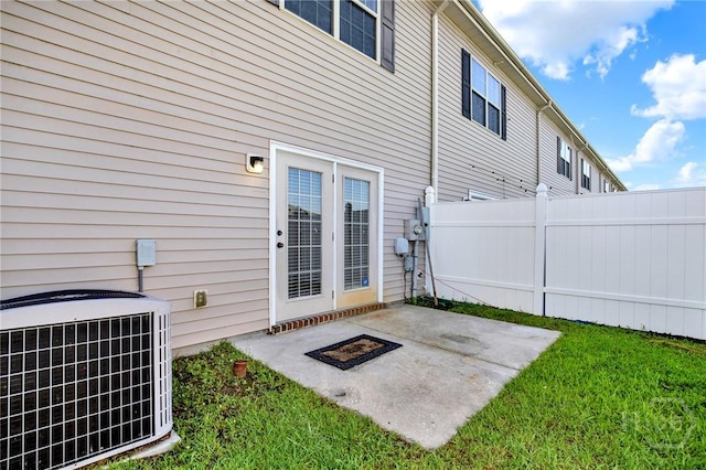 450 Canyon Oak Loop, Richmond Hill, GA 31324 - rear view of house with central air condition unit and a patio