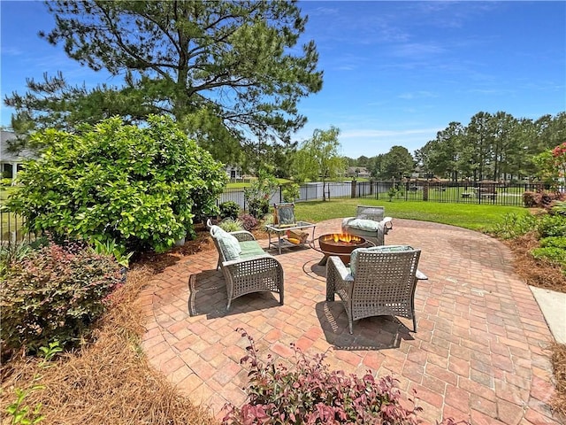 66 Misty Marsh Dr, Savannah, GA 31419 - fenced backyard with an outdoor fire pit and a patio area