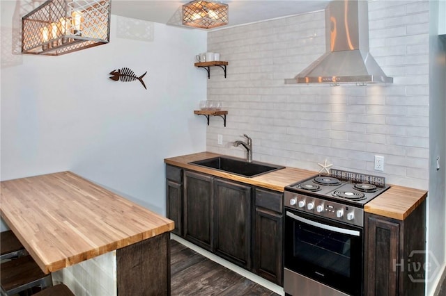 1217 Bay St Unit 131A, Tybee Island, GA 31328 - kitchen featuring wooden counters, ventilation hood, stainless steel electric stove, open shelves, and decorative backsplash