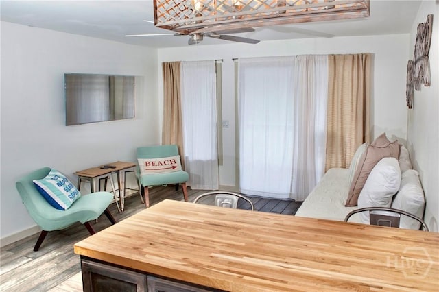 1217 Bay St Unit 131A, Tybee Island, GA 31328 - sitting room with wood finished floors and ceiling fan