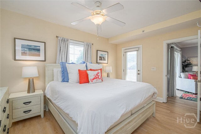 18 Silver Ave Unit 1, Tybee Island, GA 31328 - bedroom featuring multiple windows, light wood finished floors, and access to exterior