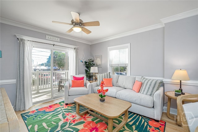 18 Silver Ave Unit 1, Tybee Island, GA 31328 - living area with healthy amount of natural light, ornamental molding, a ceiling fan, and wood finished floors