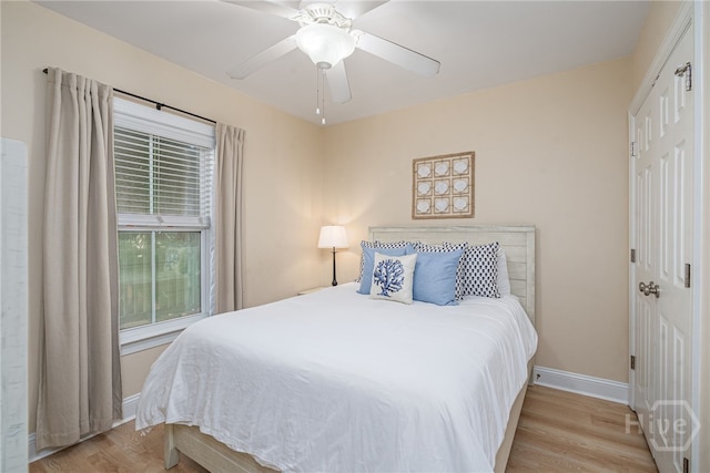 18 Silver Ave Unit 1, Tybee Island, GA 31328 - bedroom featuring light wood-type flooring, multiple windows, and a ceiling fan