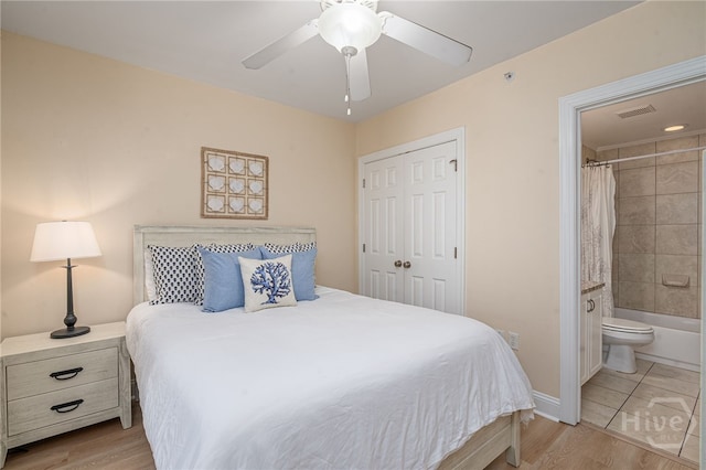 18 Silver Ave Unit 1, Tybee Island, GA 31328 - bedroom featuring a closet, a ceiling fan, light wood-type flooring, and connected bathroom