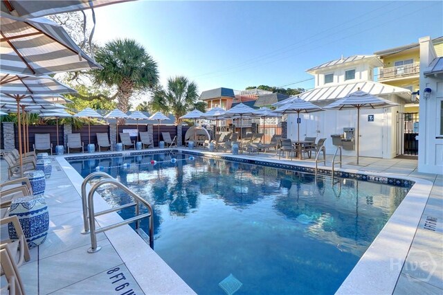 18 Silver Ave Unit 1, Tybee Island, GA 31328 - community pool with a patio area and a residential view