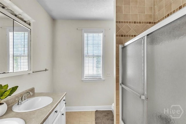473 Kolic Helmey Rd, Guyton, GA 31312 - full bathroom with healthy amount of natural light, a shower stall, tile patterned floors, and double vanity