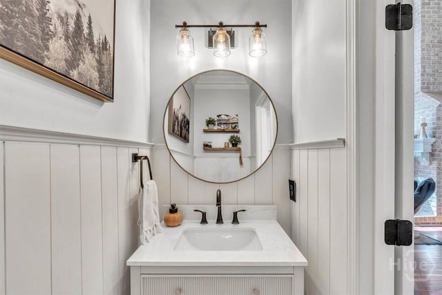 473 Kolic Helmey Rd, Guyton, GA 31312 - bathroom featuring a decorative wall, vanity, and a wainscoted wall