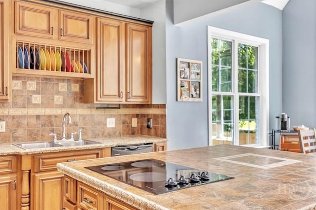 473 Kolic Helmey Rd, Guyton, GA 31312 - kitchen with a sink, black electric stovetop, light countertops, and backsplash