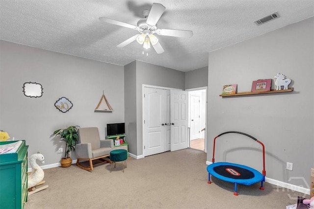 473 Kolic Helmey Rd, Guyton, GA 31312 - recreation room with carpet flooring, baseboards, a textured ceiling, and ceiling fan