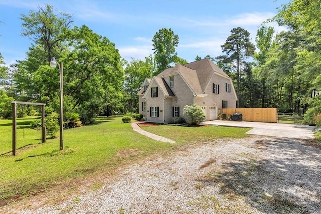 473 Kolic Helmey Rd, Guyton, GA 31312 - view of front of home featuring concrete driveway, an attached garage, and view of wooded area