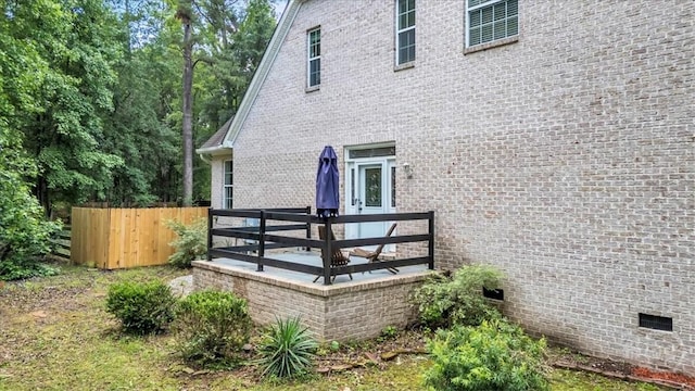 473 Kolic Helmey Rd, Guyton, GA 31312 - view of property exterior featuring fence, brick siding, and crawl space