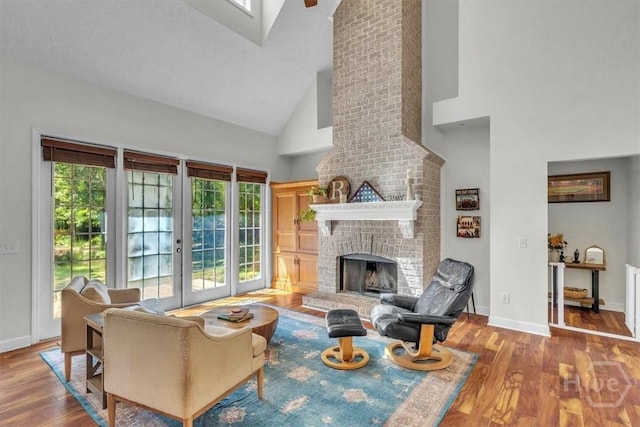 473 Kolic Helmey Rd, Guyton, GA 31312 - living area featuring high vaulted ceiling, light wood-style flooring, french doors, a fireplace, and baseboards