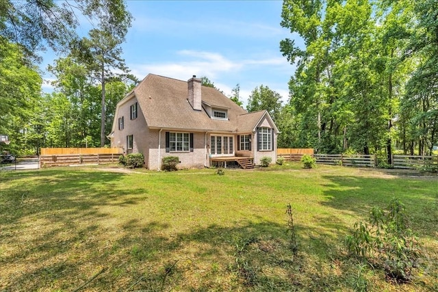 473 Kolic Helmey Rd, Guyton, GA 31312 - back of property featuring a chimney and a deck