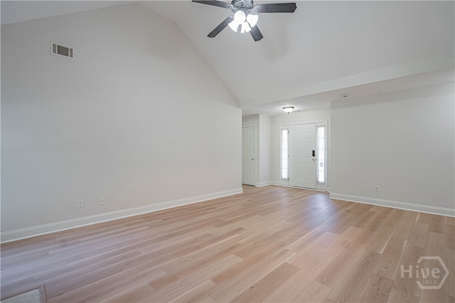 110 Pembroke Pl, Pembroke, GA 31321 - unfurnished living room featuring a ceiling fan, high vaulted ceiling, light wood finished floors, and baseboards