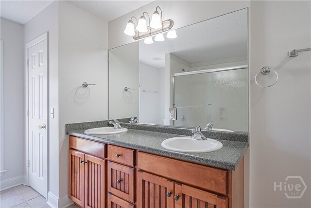 110 Pembroke Pl, Pembroke, GA 31321 - full bath with a stall shower, double vanity, and tile patterned floors