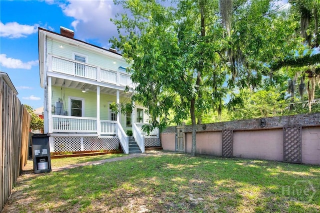 835 E Duffy St, Savannah, GA 31401 - back of property featuring a porch, a balcony, and a chimney