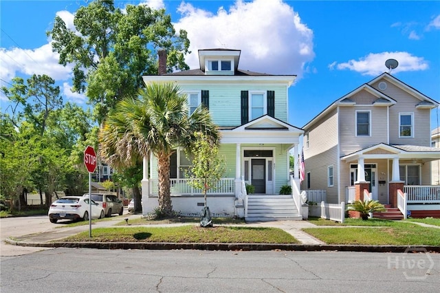 835 E Duffy St, Savannah, GA 31401 - american foursquare style home with covered porch and a chimney