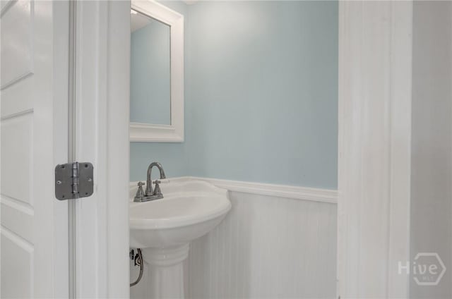 835 E Duffy St, Savannah, GA 31401 - bathroom with a wainscoted wall and a sink