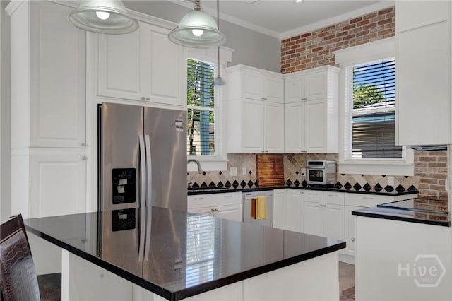 835 E Duffy St, Savannah, GA 31401 - kitchen featuring stainless steel refrigerator with ice dispenser, dishwasher, dark countertops, white cabinetry, and crown molding