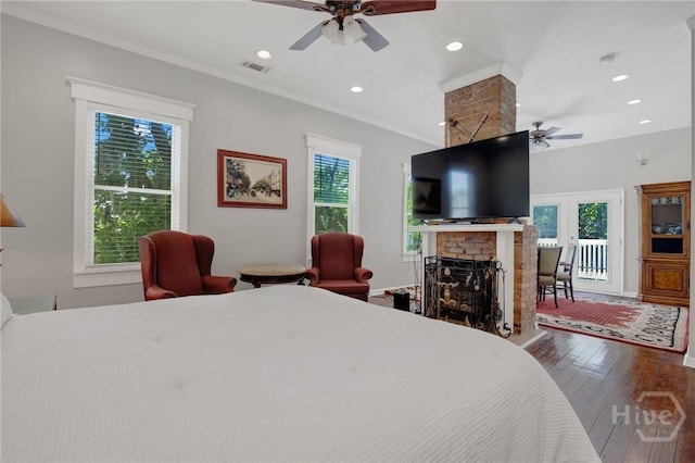 835 E Duffy St, Savannah, GA 31401 - bedroom with a brick fireplace, hardwood / wood-style floors, access to exterior, a ceiling fan, and recessed lighting