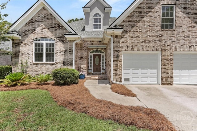 2 Misty Marsh Ct, Savannah, GA 31419 - view of front of property with concrete driveway, brick siding, and a shingled roof