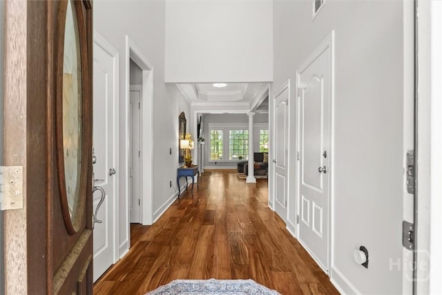 2 Misty Marsh Ct, Savannah, GA 31419 - entryway featuring wood finished floors, a raised ceiling, crown molding, decorative columns, and baseboards