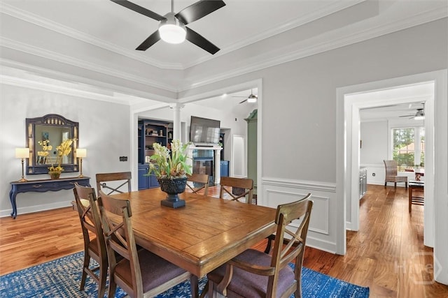 2 Misty Marsh Ct, Savannah, GA 31419 - dining room featuring a ceiling fan, wood finished floors, ornamental molding, and a wainscoted wall