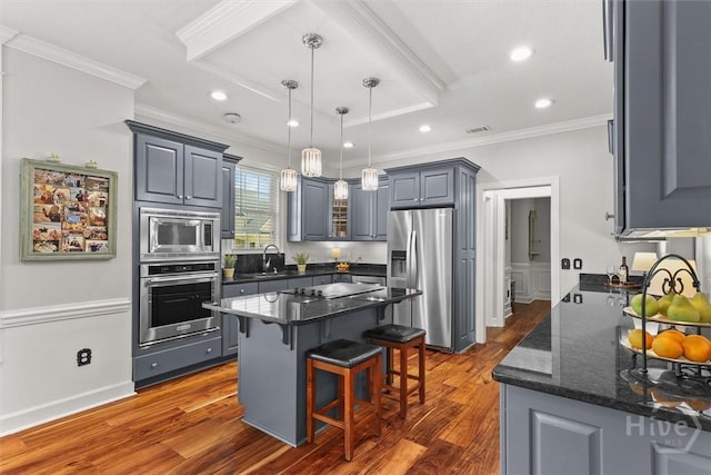 2 Misty Marsh Ct, Savannah, GA 31419 - kitchen featuring stainless steel appliances, a sink, crown molding, dark wood finished floors, and a kitchen bar