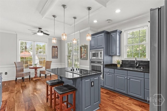 2 Misty Marsh Ct, Savannah, GA 31419 - kitchen with stainless steel appliances, plenty of natural light, ornamental molding, a center island, and ceiling fan