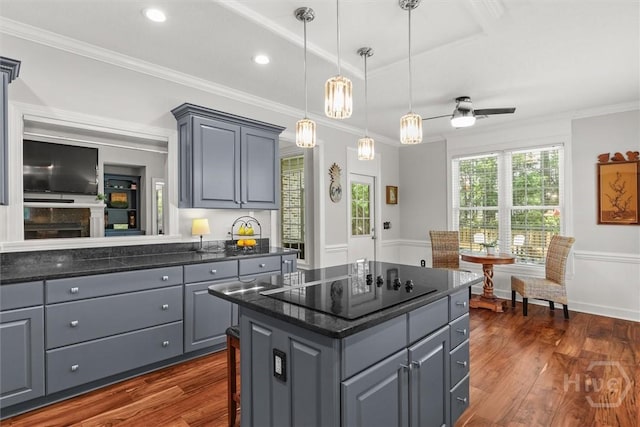 2 Misty Marsh Ct, Savannah, GA 31419 - kitchen featuring gray cabinets, black electric cooktop, a center island, dark wood-type flooring, and crown molding