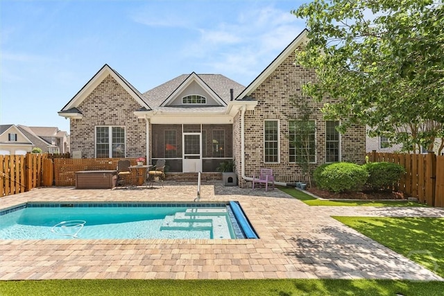 2 Misty Marsh Ct, Savannah, GA 31419 - back of property with brick siding, a sunroom, a patio area, and a fenced backyard