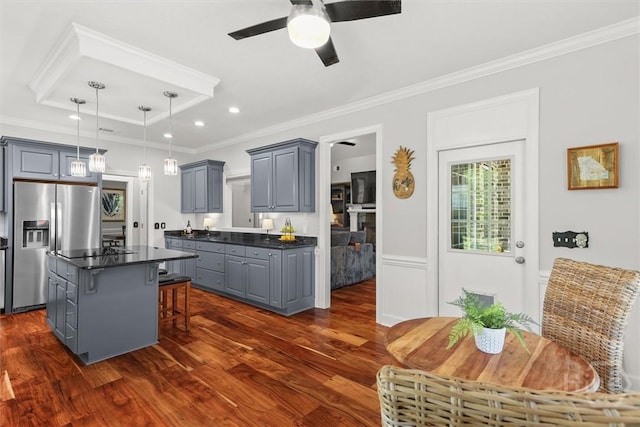 2 Misty Marsh Ct, Savannah, GA 31419 - kitchen with stainless steel refrigerator with ice dispenser, gray cabinets, dark countertops, a kitchen breakfast bar, and ornamental molding